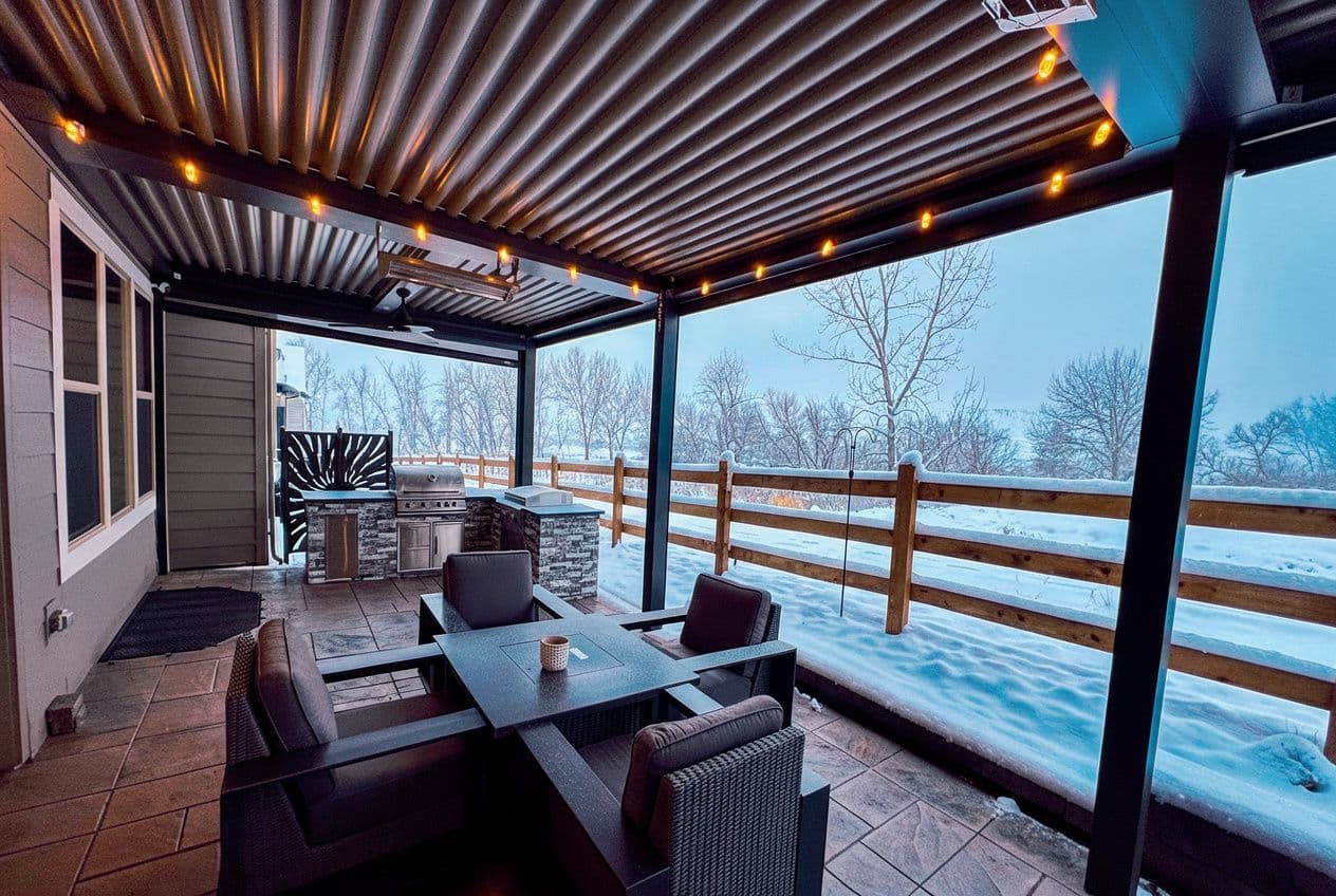 A Colorado patio with shade structure over it and snow outside.